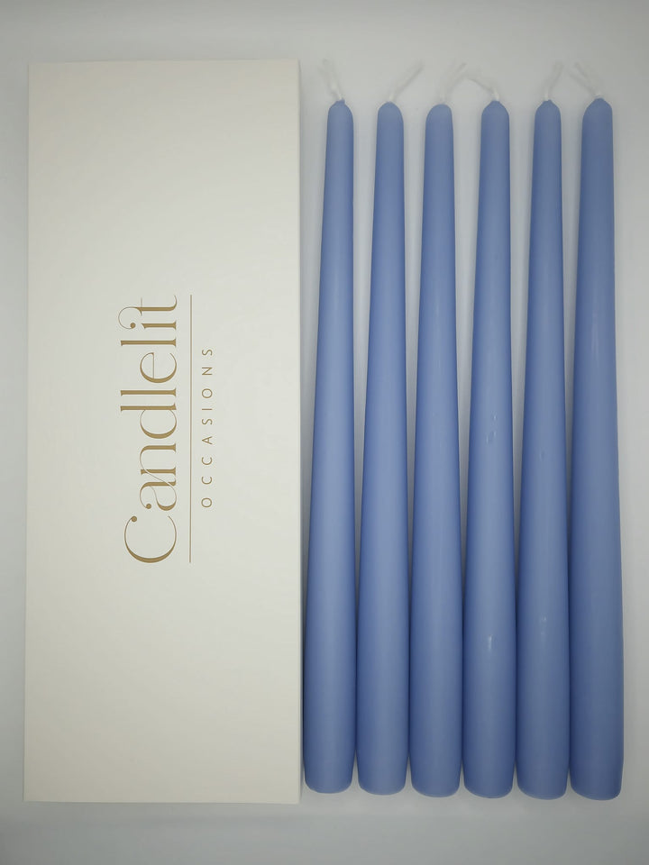 Sky blue taper candles styled for luxury wedding tablescape